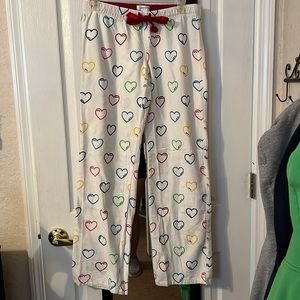 Aero sweatpants. Size S. White with color hearts.